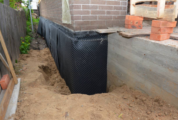 Happy homeowners after waterproofing job in San Pierre